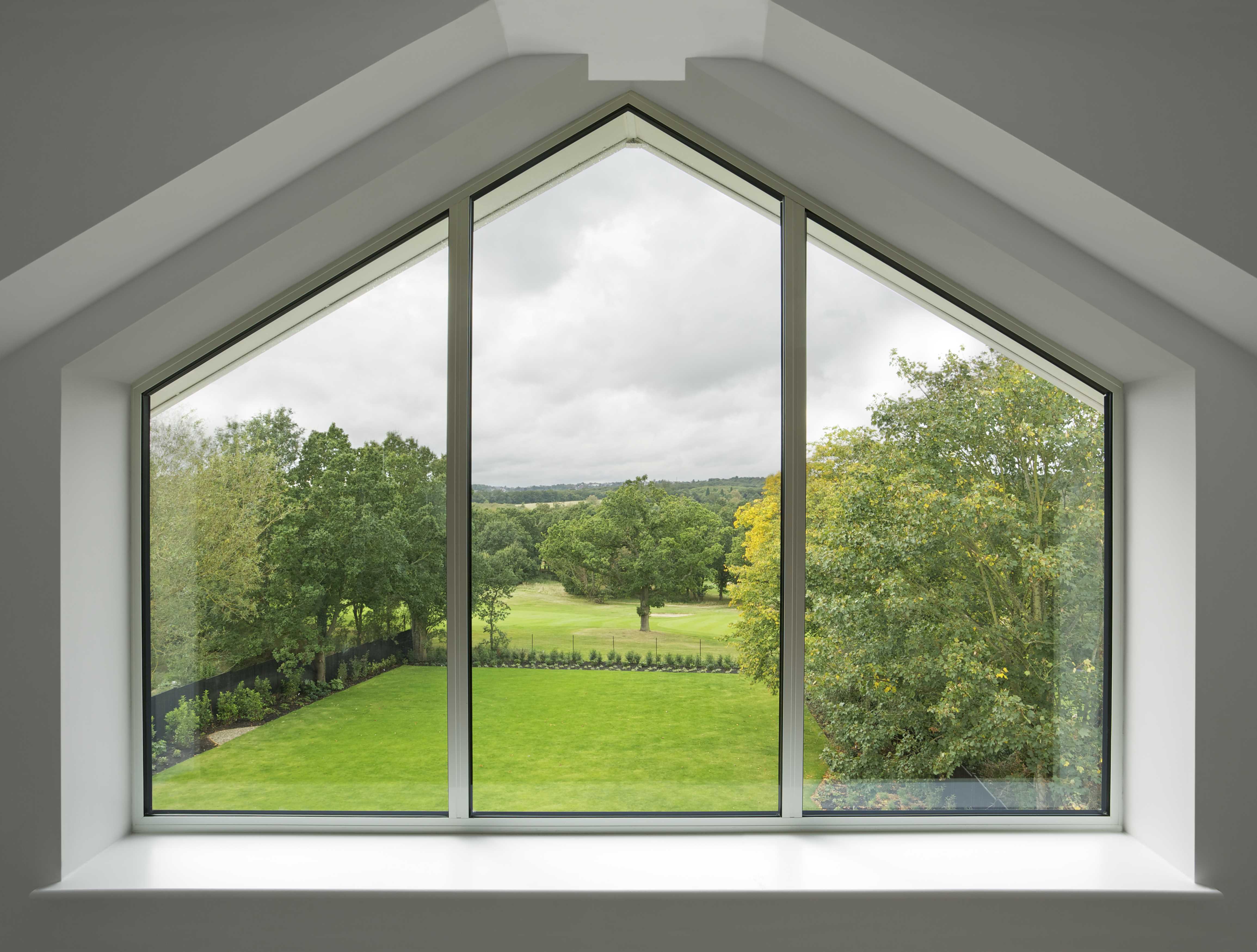 window looking out over a garden and trees